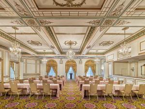 a banquet hall with tables and chairs in a room at Fairmont Copley Plaza in Boston
