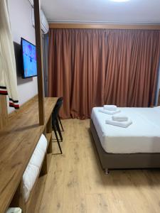 Hotel Dodona 객실 침대