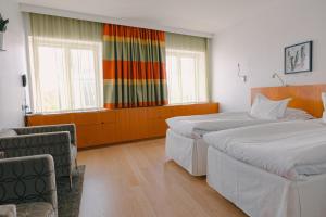 Voodi või voodid majutusasutuse Avalon Hotel toas