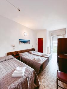 Postel nebo postele na pokoji v ubytování Hotel Paglierani - Nuova gestione 2024