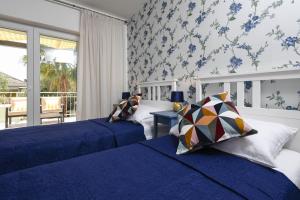 Un pat sau paturi într-o cameră la Holiday Villa Oliva