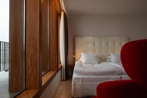 Voodi või voodid majutusasutuse Avalon Hotel toas