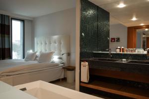 Voodi või voodid majutusasutuse Avalon Hotel toas