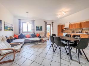 a living room with a couch and a table at Holiday Home LuxuSölk-5 by Interhome in Stein an der Enns