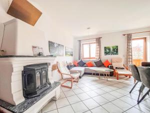 a living room with a fireplace and a couch at Holiday Home LuxuSölk-5 by Interhome in Stein an der Enns