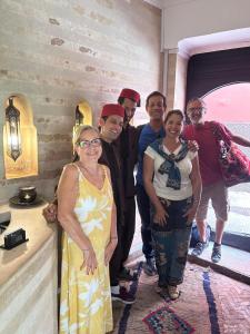 a group of people posing for a picture at Riad Les Nuits de Marrakech in Marrakech