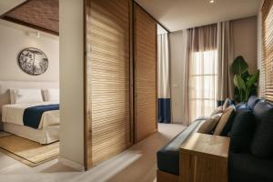 מיטה או מיטות בחדר ב-Sewelo Suites