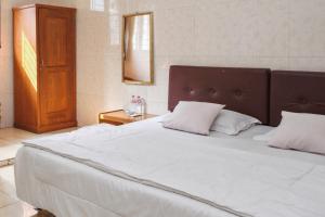 Letto o letti in una camera di Wisma Rumka