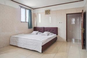 Letto o letti in una camera di Wisma Rumka
