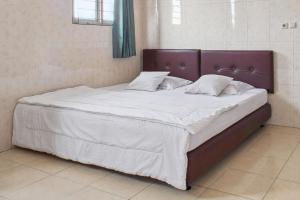 Letto o letti in una camera di Wisma Rumka