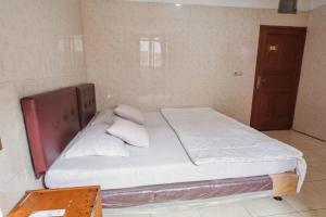 Letto o letti in una camera di Wisma Rumka