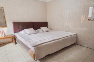 Letto o letti in una camera di Wisma Rumka