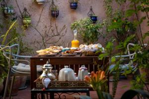 a table with food and tea on top of it at Lalla Ghayta in Chefchaouen