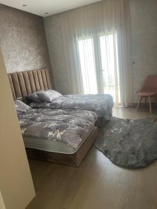 מיטה או מיטות בחדר ב-Villa Naouma