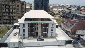 a building with a sign on the top of it at Genesis Grid Homes - Petra in Lekki