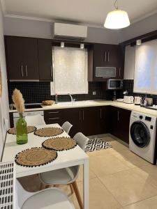 a kitchen with a table with cookies on it at VILLA ELLI in Chóïka