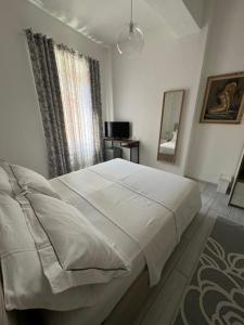Postel nebo postele na pokoji v ubytování Casa L'Aquila