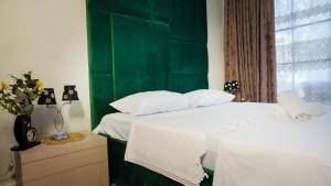 Łóżko lub łóżka w pokoju w obiekcie Todo apartements