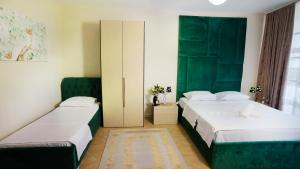 Łóżko lub łóżka w pokoju w obiekcie Todo apartements