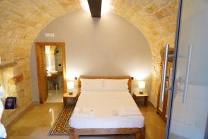 Postel nebo postele na pokoji v ubytování Terra di Trani