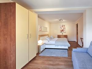 Ένα ή περισσότερα κρεβάτια σε δωμάτιο στο visit baltic - Rycerska
