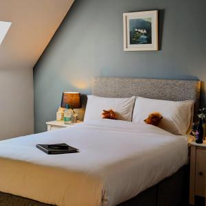 Un pat sau paturi într-o cameră la Ben Cruachan Inn