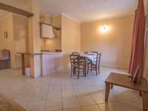 a kitchen and dining room with a table and chairs at Apartment Thermae Apartment 24 by Interhome in Sorano +25 photos