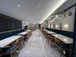 a row of tables and chairs in a restaurant at Boutique Dedem Hotel Sultanahmet in Istanbul
