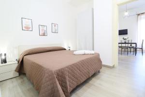 Ένα ή περισσότερα κρεβάτια σε δωμάτιο στο B&B Lepanto 144