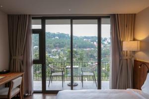 Voodi või voodid majutusasutuse HLS Dalat Lodge toas