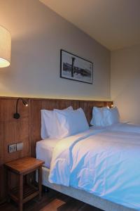 Voodi või voodid majutusasutuse HLS Dalat Lodge toas