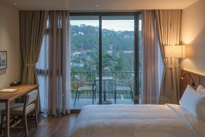 Voodi või voodid majutusasutuse HLS Dalat Lodge toas