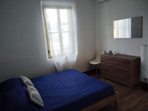 Ένα ή περισσότερα κρεβάτια σε δωμάτιο στο Casa vacanze Libertà +13 φωτογραφίες