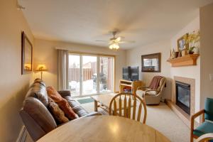 a living room with a couch and a table at Condo in Cedar Creek with Shuttle to Big Sky Resort! in Gallatin Gateway