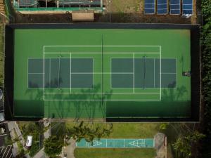 an overhead view of a tennis court with two courts at Banyan Harbor Resort in Lihue