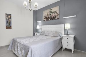 Ένα ή περισσότερα κρεβάτια σε δωμάτιο στο Apartamento Aryan - sólo familias