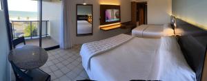 Cama ou camas em um quarto em HOTEL PIRÂMIDE NATAL