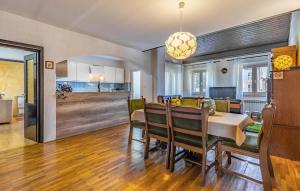 a kitchen and dining room with a table and chairs at Apartment Fucane Iv in Medulin