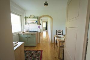 a kitchen with a table and a dining room at Vila Zora in Dobrna