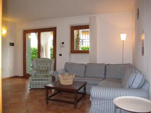 a living room with a couch and two chairs at Apartment Adelaide by Interhome in Albisano