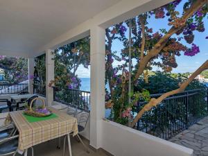 a balcony with a table and a view of the ocean at Apartment Rubin-2 by Interhome in Zastražišće