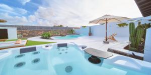 The swimming pool at or close to UNIQUE Homes Lajares - Only Adults