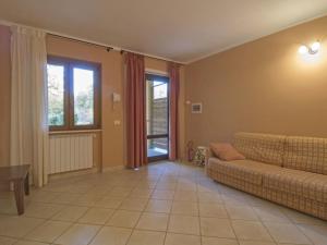 a living room with a couch and a table at Apartment Thermae Apartment 16b by Interhome in Sorano +23 photos