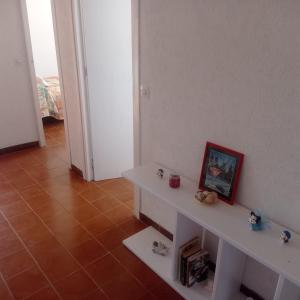 a room with a white table with a picture on it at Ca La Montserrat - Wine Rural House in San Martín Sarroca
