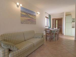 a living room with a couch and a table at Apartment Thermae Apartment 23 by Interhome in Sorano