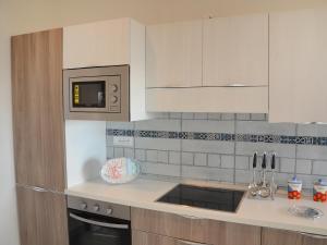 a kitchen with a sink and a microwave at Apartment Appartamento 1 by Interhome in Terracina