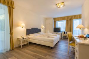 Postel nebo postele na pokoji v ubytování Hotel Funggashof
