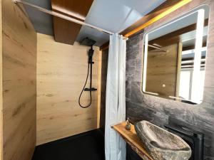 a bathroom with a sink and a mirror at Chalet MOOS in Todtmoos +40 photos