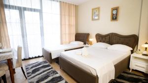 Łóżko lub łóżka w pokoju w obiekcie Todo apartements