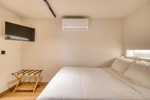 Postel nebo postele na pokoji v ubytování Vittore Gambello Rooms